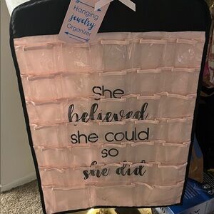 Clear hanger/ organizer “she believed she could, so she did” 66 pockets total